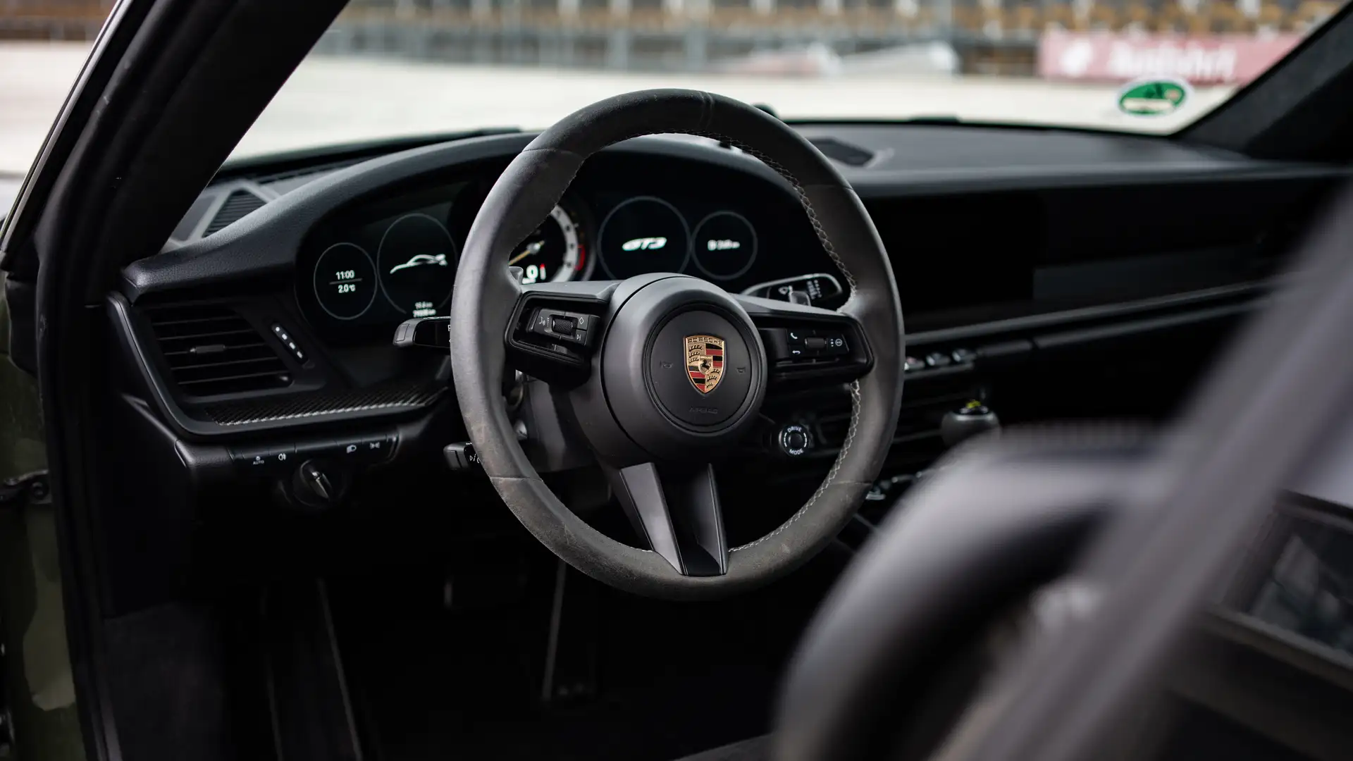 The steering wheel and interior of a Porsche 911 GT3.